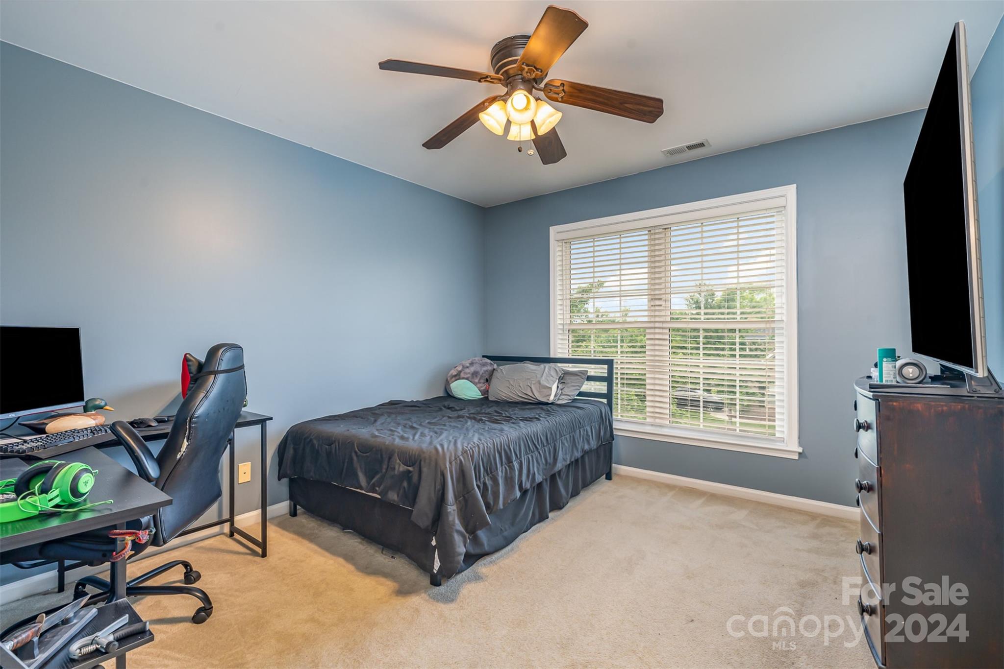 1814 Montague Road Clover, SC 29710 - Photo 21 of 33 a bedroom with a bed and a chandelier