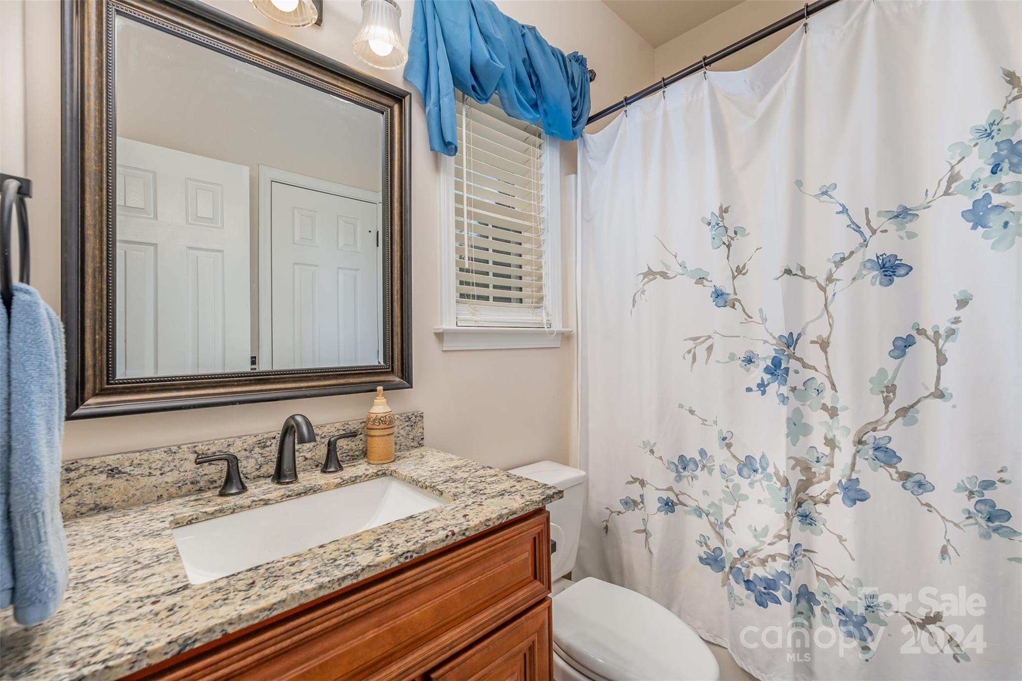 1814 Montague Road Clover, SC 29710 - Photo 29 of 33 a bathroom with a granite countertop sink and a mirror