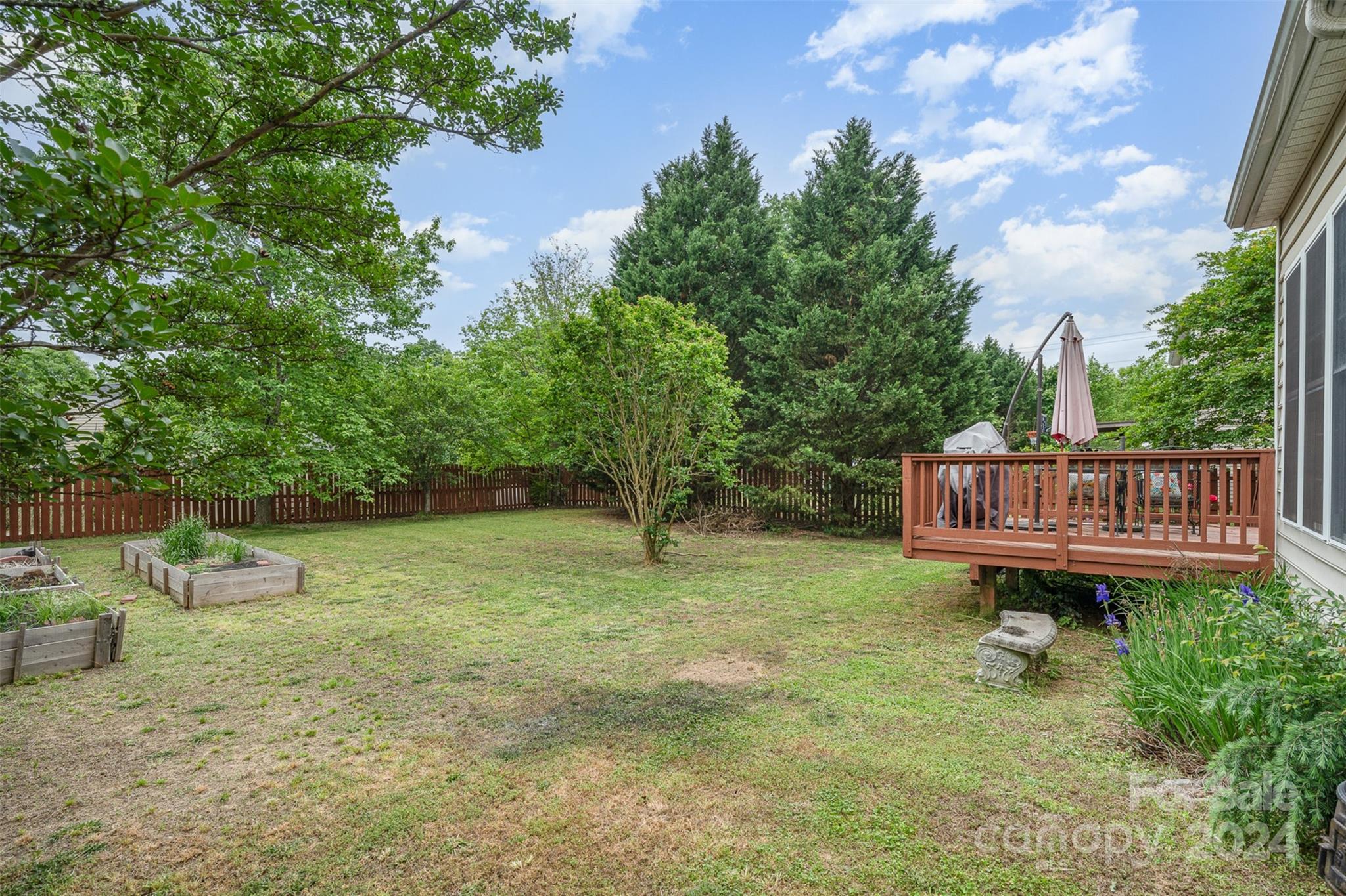 1814 Montague Road Clover, SC 29710 - Photo 33 of 33 a view of a backyard with wooden fence and a bench