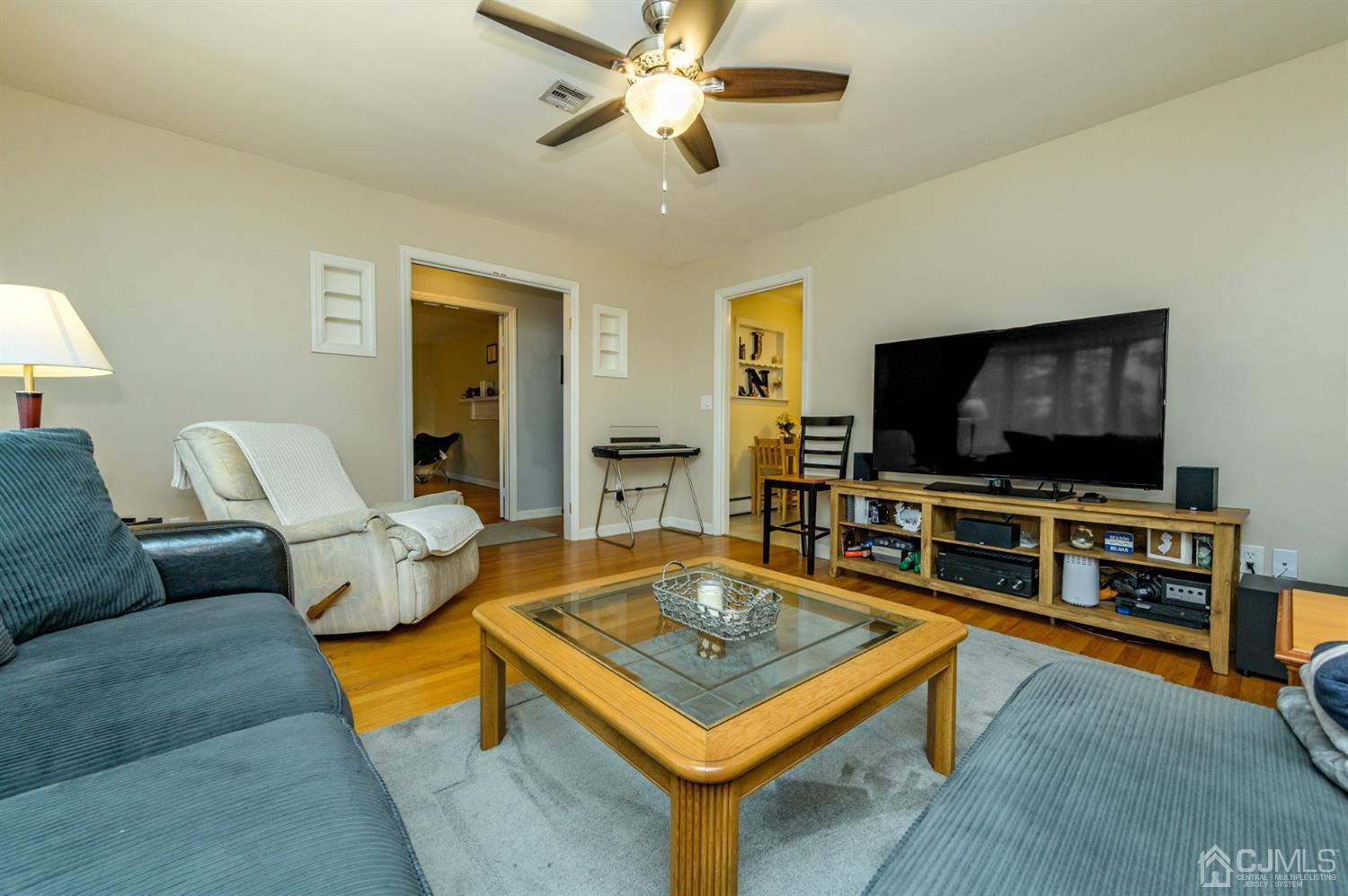 1727 River Road Belmar, NJ 07719 - Photo 8 of 38 a living room with furniture and a flat screen tv