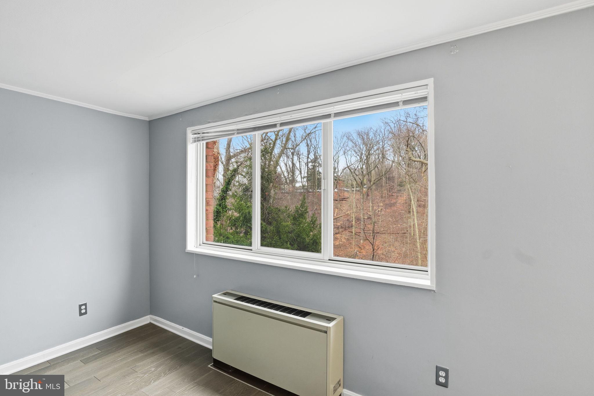2710 Macomb Street Northwest, Unit 207 Washington, DC 20008 - Photo 15 of 32 a view of an empty room with a window