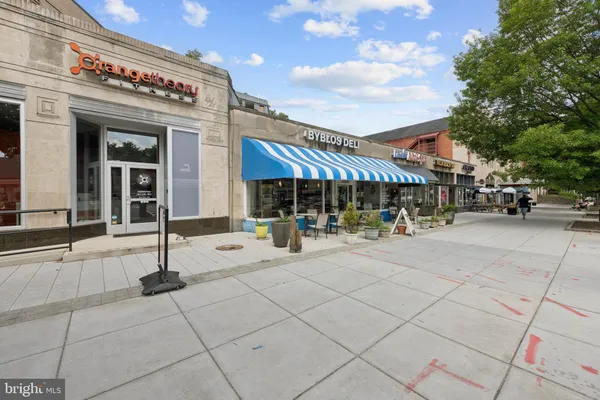 a view of a patio with chair and tables