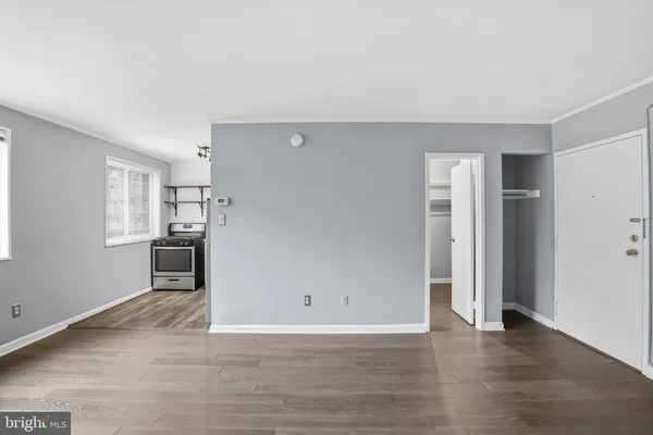 a view of a kitchen with a sink and a refrigerator