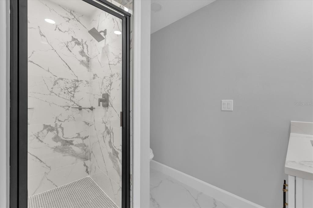 2404 Center Street Sanford, FL 32771 - Photo 14 of 29 a bathroom with a shower