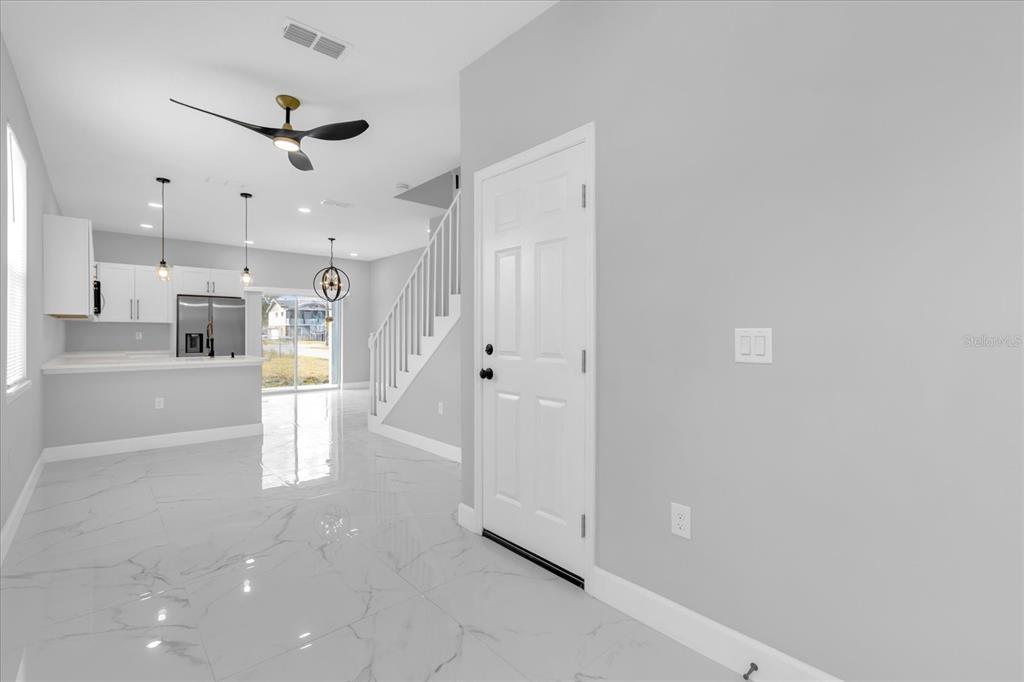 2404 Center Street Sanford, FL 32771 - Photo 9 of 29 a view of a kitchen with a sink and a refrigerator
