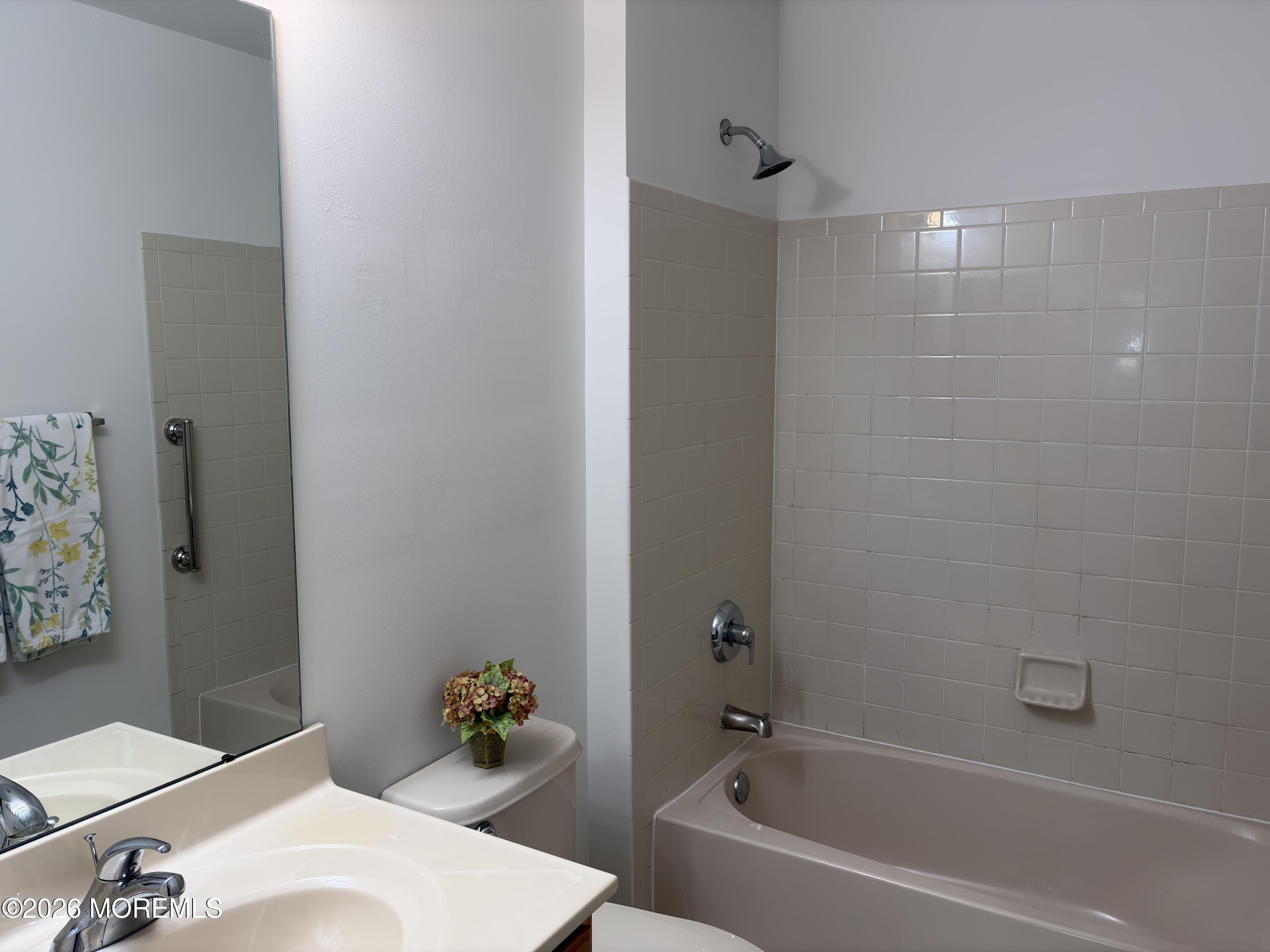 35 Meadows Lane Whiting, NJ 08759 - Photo 17 of 23 a white bath tub sitting next to a white toilet and vanity