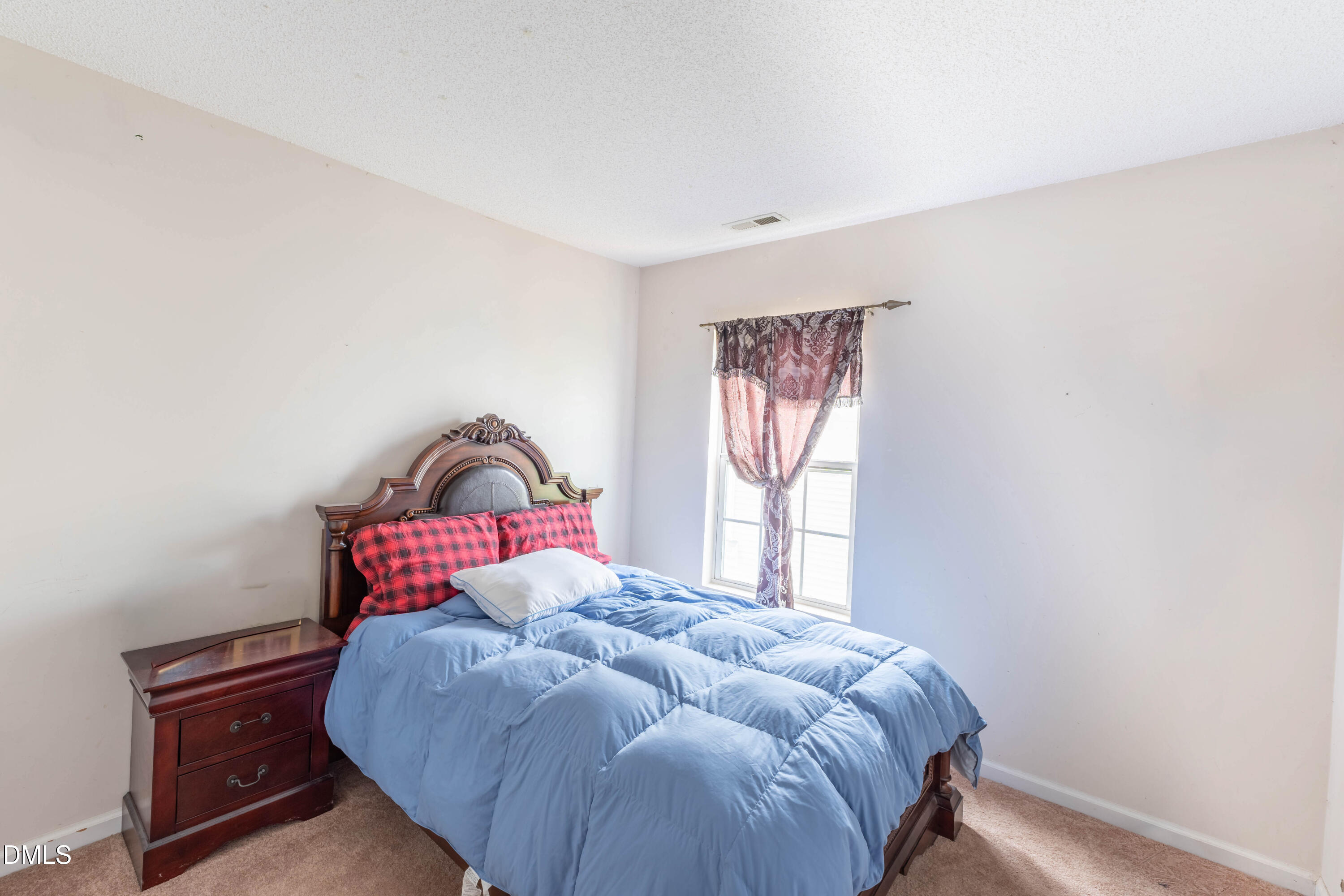 220 Purple Leaf Road Fuquay-Varina, NC 27526 - Photo 11 of 18 a bedroom with a bed and a window