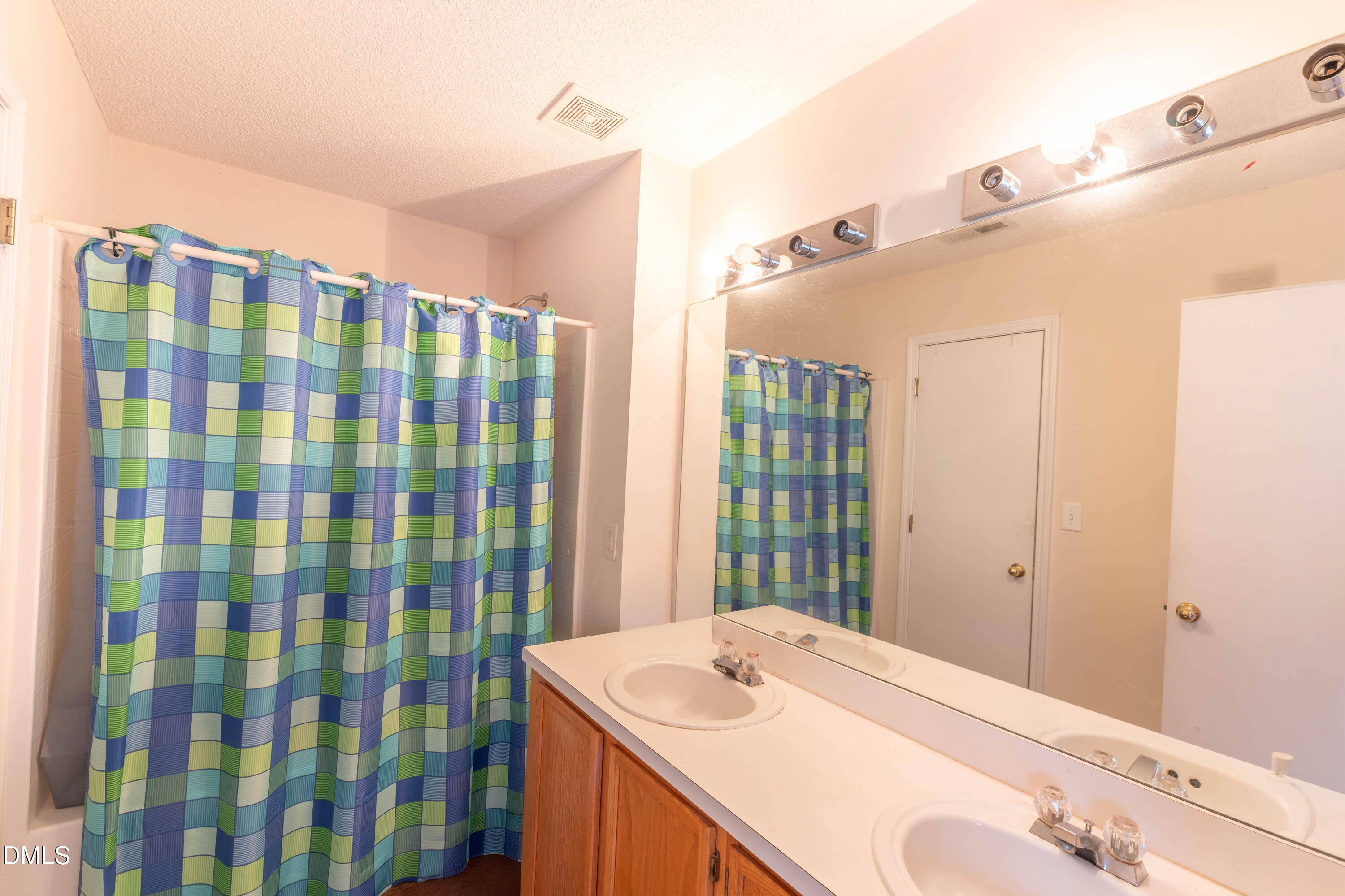 220 Purple Leaf Road Fuquay-Varina, NC 27526 - Photo 14 of 18 a bathroom with a sink and a mirror