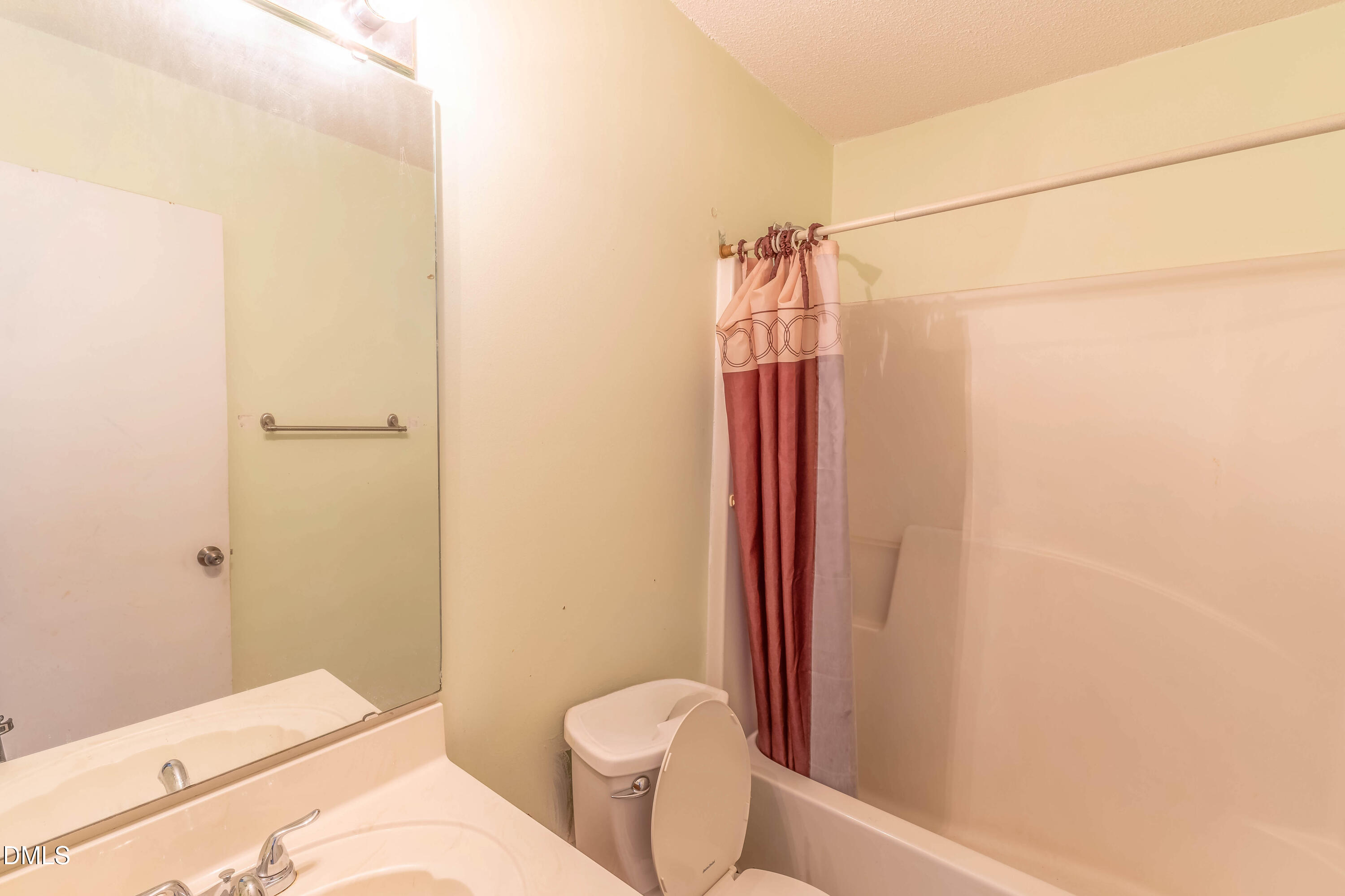 220 Purple Leaf Road Fuquay-Varina, NC 27526 - Photo 15 of 18 a bathroom with a shower and a toilet