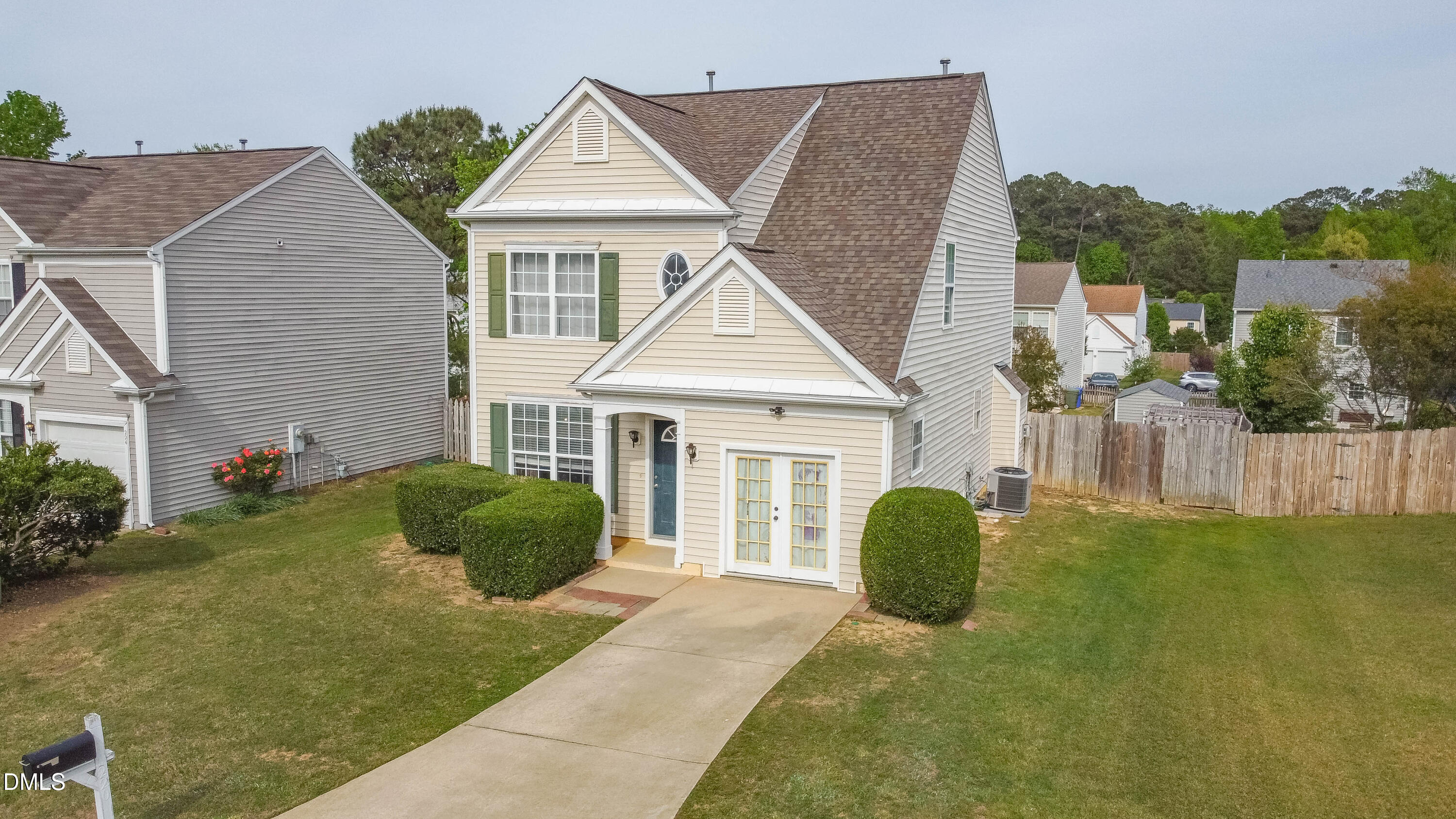 220 Purple Leaf Road Fuquay-Varina, NC 27526 - Photo 2 of 18 a front view of a house with a yard and garage