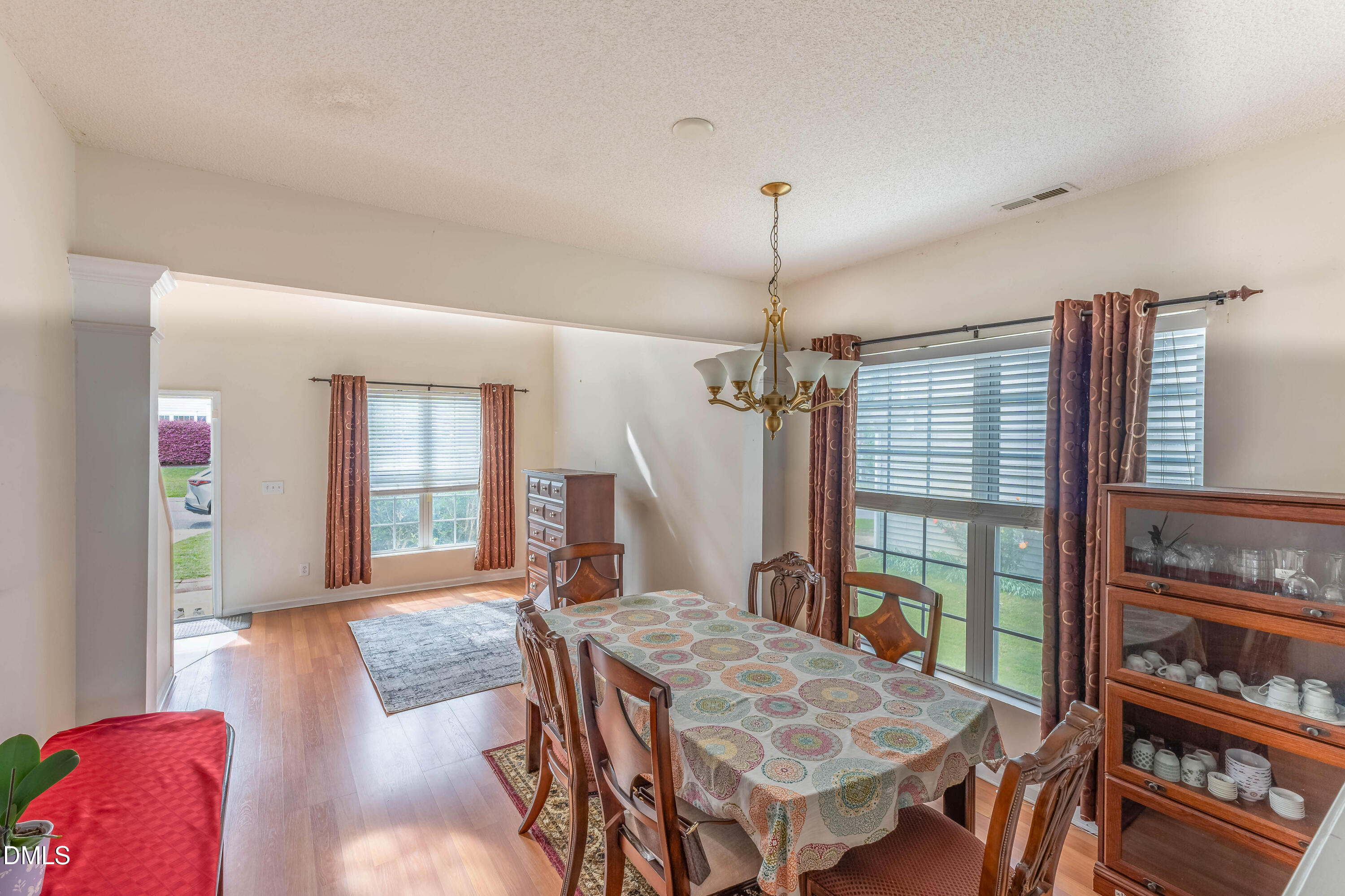 220 Purple Leaf Road Fuquay-Varina, NC 27526 - Photo 5 of 18 a view of a livingroom with furniture window and wooden floor