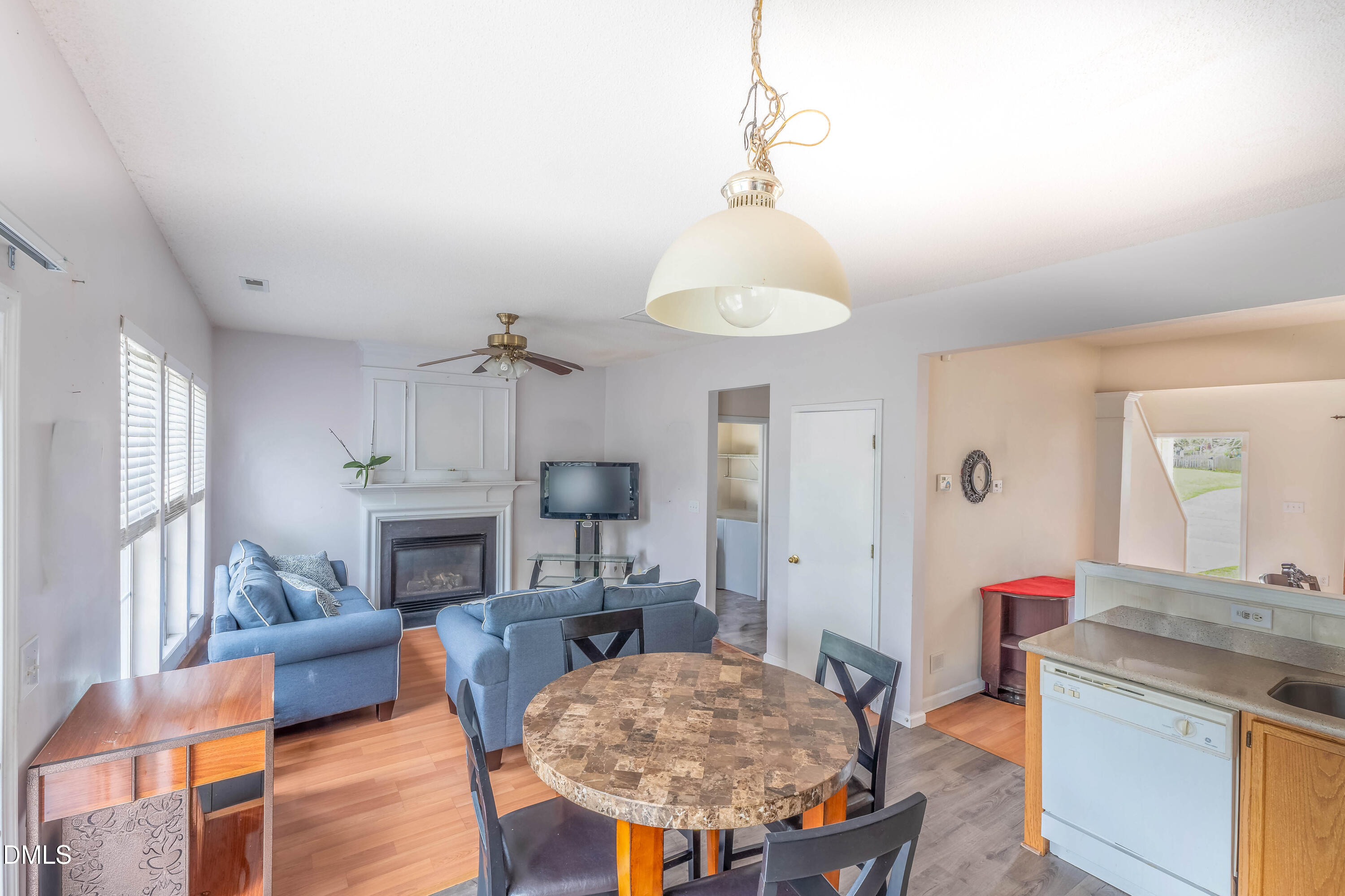 220 Purple Leaf Road Fuquay-Varina, NC 27526 - Photo 7 of 18 a living room with furniture and a chandelier