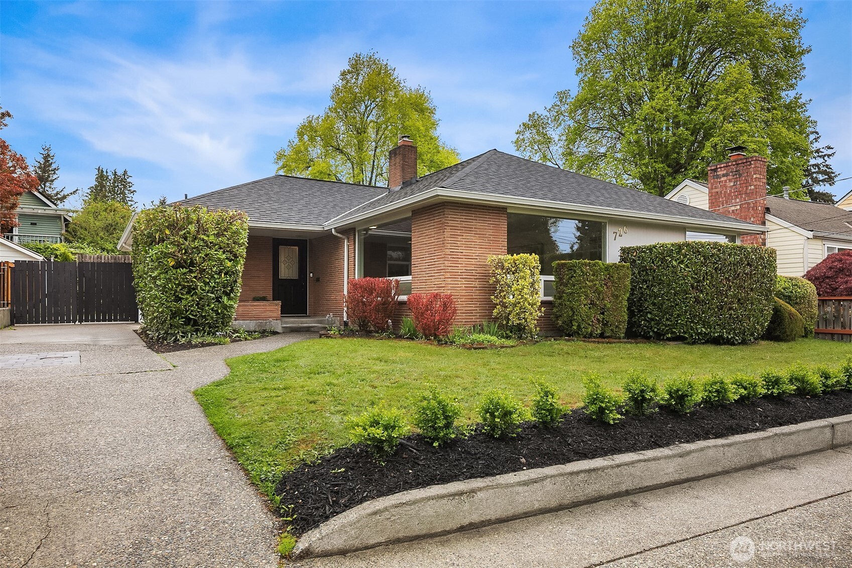 726 North 86th Street Seattle, WA 98103 - Photo 1 of 31 a front view of a house with garden