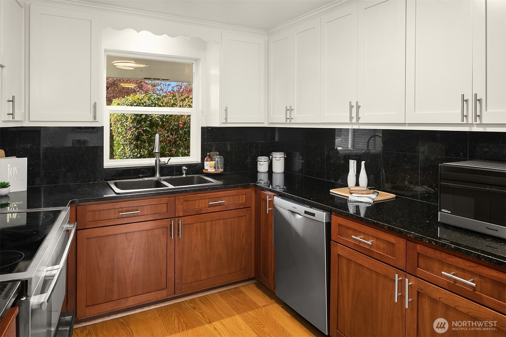 726 North 86th Street Seattle, WA 98103 - Photo 11 of 31 a kitchen with granite countertop a sink and cabinets