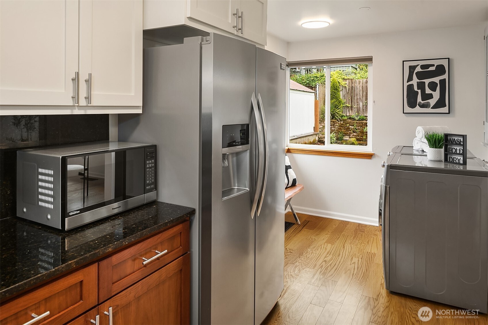 726 North 86th Street Seattle, WA 98103 - Photo 12 of 31 a kitchen with stainless steel appliances a refrigerator stove and microwave