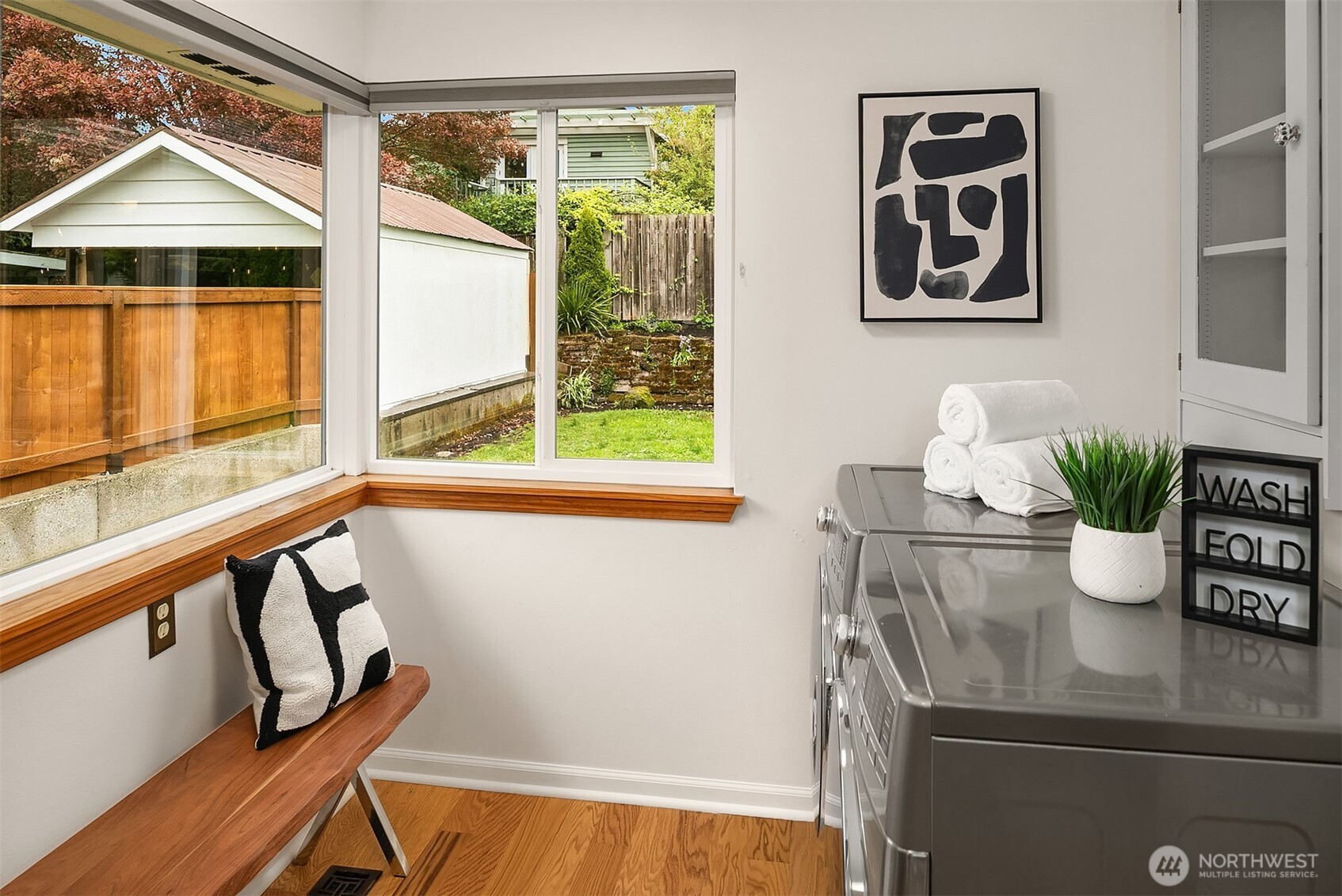 726 North 86th Street Seattle, WA 98103 - Photo 13 of 31 a view of table and chair with potted plant