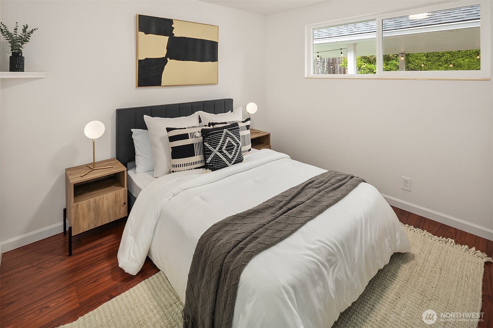 726 North 86th Street Seattle, WA 98103 - Photo 14 of 31 a bedroom with a bed and a painting on the wall