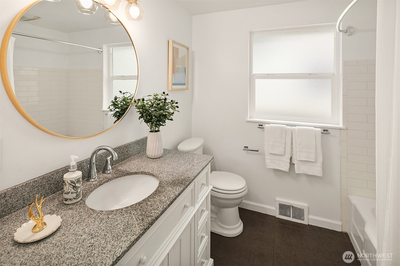 726 North 86th Street Seattle, WA 98103 - Photo 15 of 31 a bathroom with a granite countertop sink and a mirror