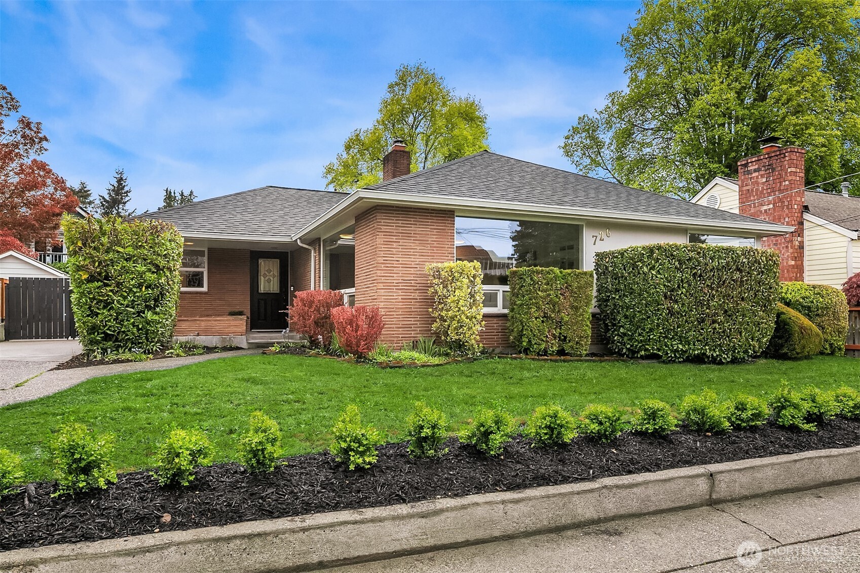 726 North 86th Street Seattle, WA 98103 - Photo 2 of 31 a front view of a house with a garden