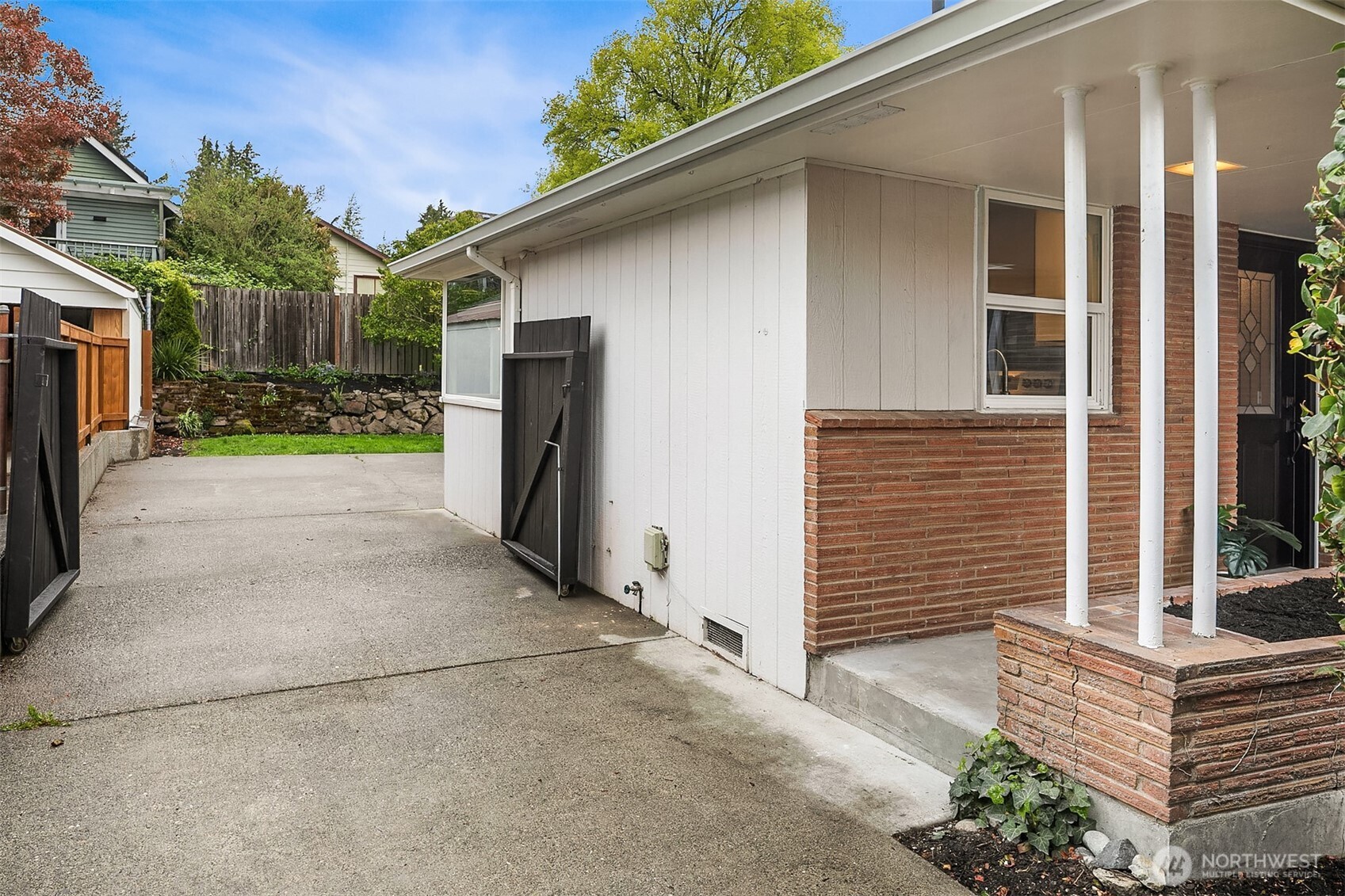 726 North 86th Street Seattle, WA 98103 - Photo 27 of 31 a view of a house with a yard and large tree