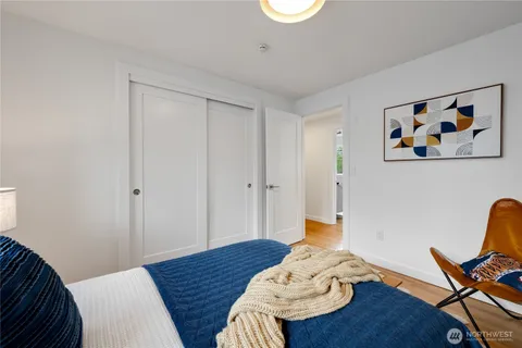 a bedroom with a bed and a chair