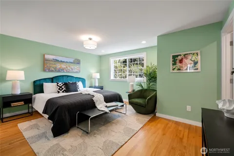 a bedroom with a bed and a couch
