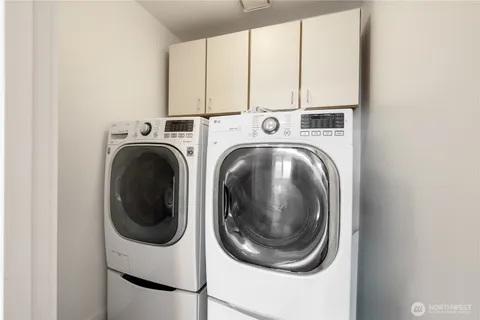 a close up view of a washer and dryer in a utility room