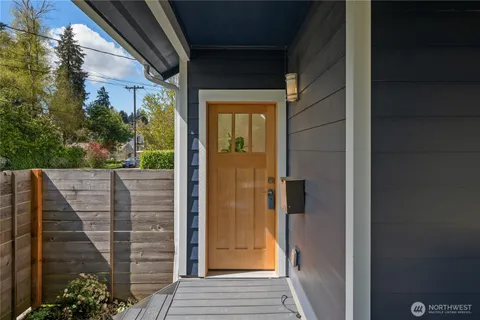 a view of a door and wooden floor