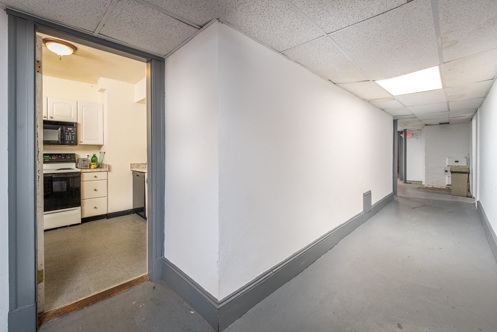 12 Ransom Road, Unit 16 Boston, MA 02135 - Photo 14 of 17 a view of a kitchen with a sink and dishwasher stove top oven