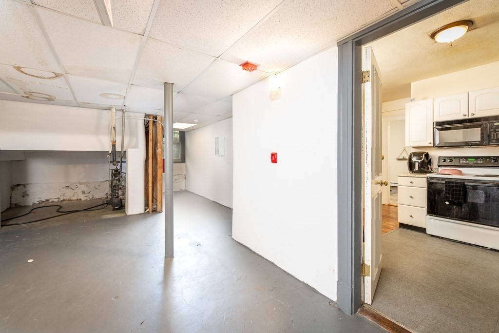 12 Ransom Road, Unit 16 Boston, MA 02135 - Photo 15 of 17 a view of a kitchen with a refrigerator and a stove top oven
