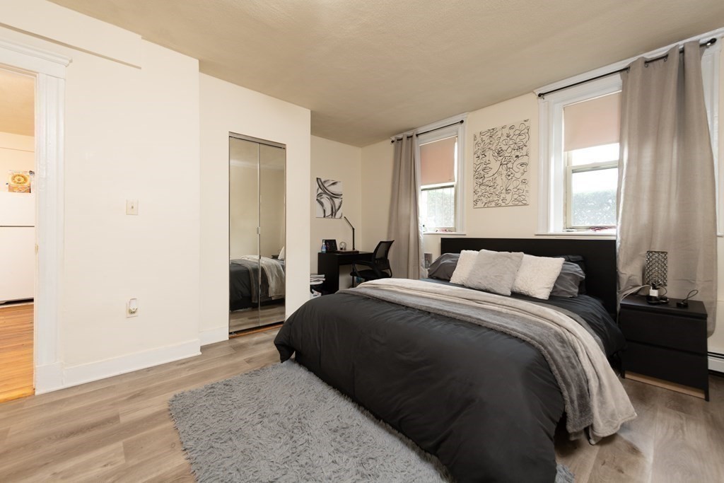 12 Ransom Road, Unit 16 Boston, MA 02135 - Photo 7 of 17 a bedroom with a bed and a window