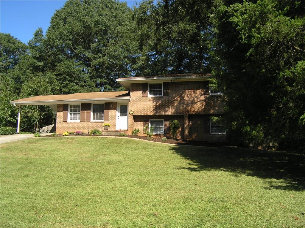 1160 Mayfield Drive Decatur, GA 30033 - Photo 1 of 1 a front view of a house with garden