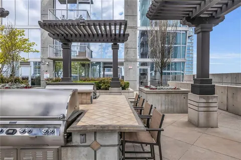 a patio with a table and chairs