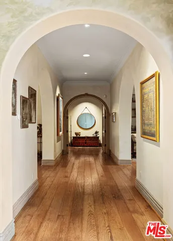 a bedroom with a large bed and a large window