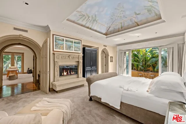 a view of a livingroom with furniture and a potted plant