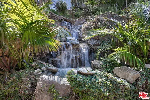 swimming pool view with a seating space