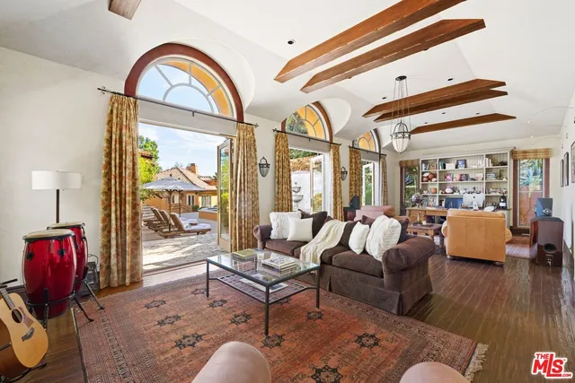 a kitchen with a stove a sink and a window