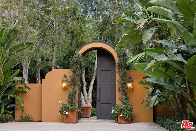 a front view of a house with yard