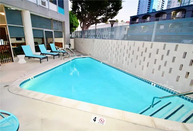 a view of swimming pool with outdoor seating