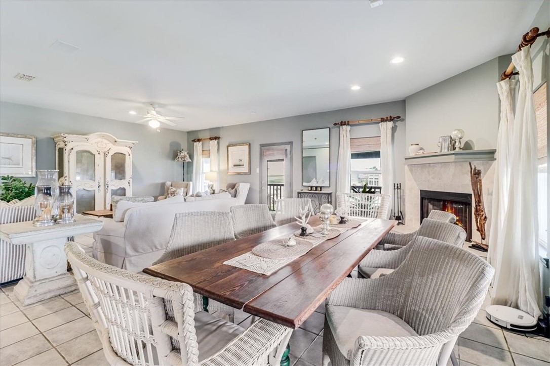 488 Margo Lane Port Aransas, TX 78373 - Photo 12 of 40 a living room with furniture a fireplace and a table