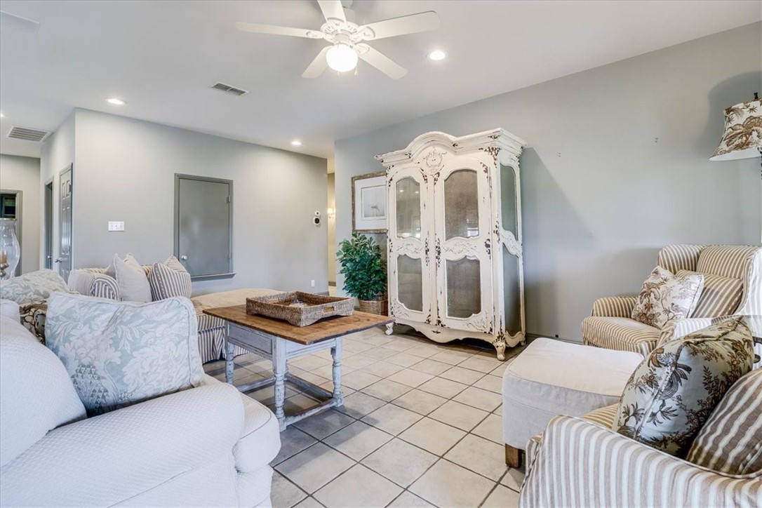 488 Margo Lane Port Aransas, TX 78373 - Photo 14 of 40 a living room with furniture and a chandelier