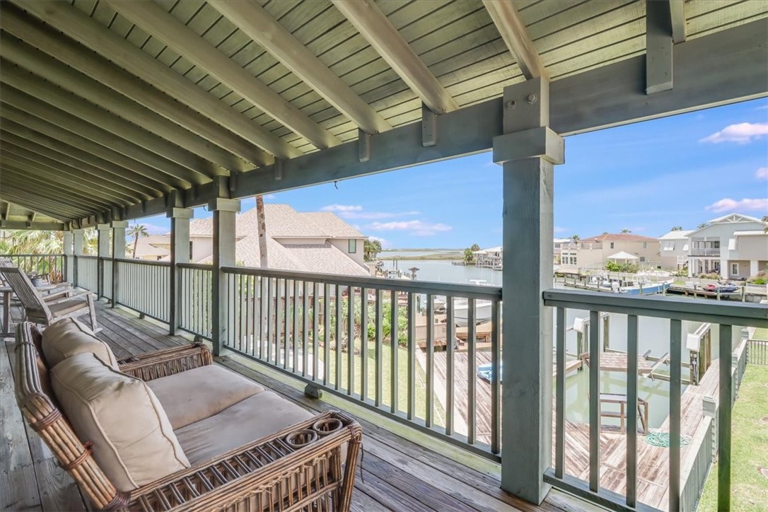 488 Margo Lane Port Aransas, TX 78373 - Photo 16 of 40 a balcony with wooden floor