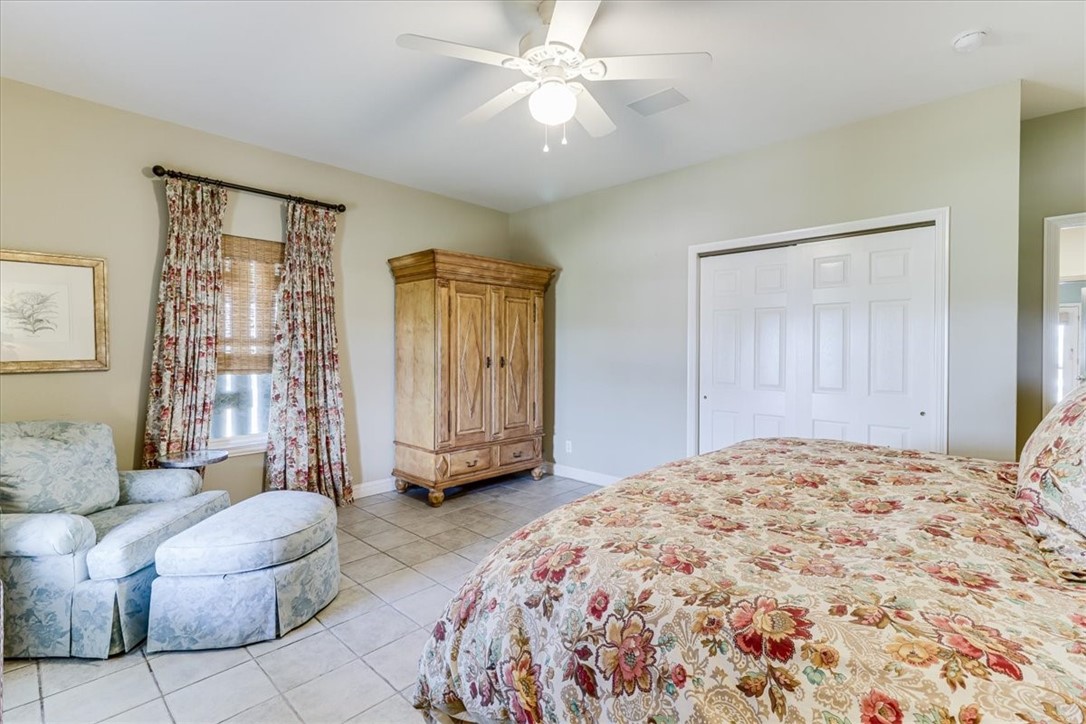 488 Margo Lane Port Aransas, TX 78373 - Photo 22 of 40 a spacious bedroom with a bed and closet