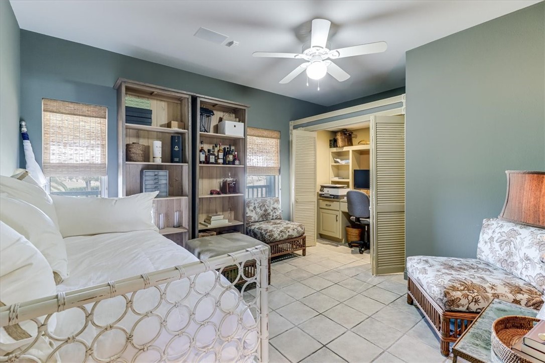 488 Margo Lane Port Aransas, TX 78373 - Photo 24 of 40 a living room with furniture and a chandelier