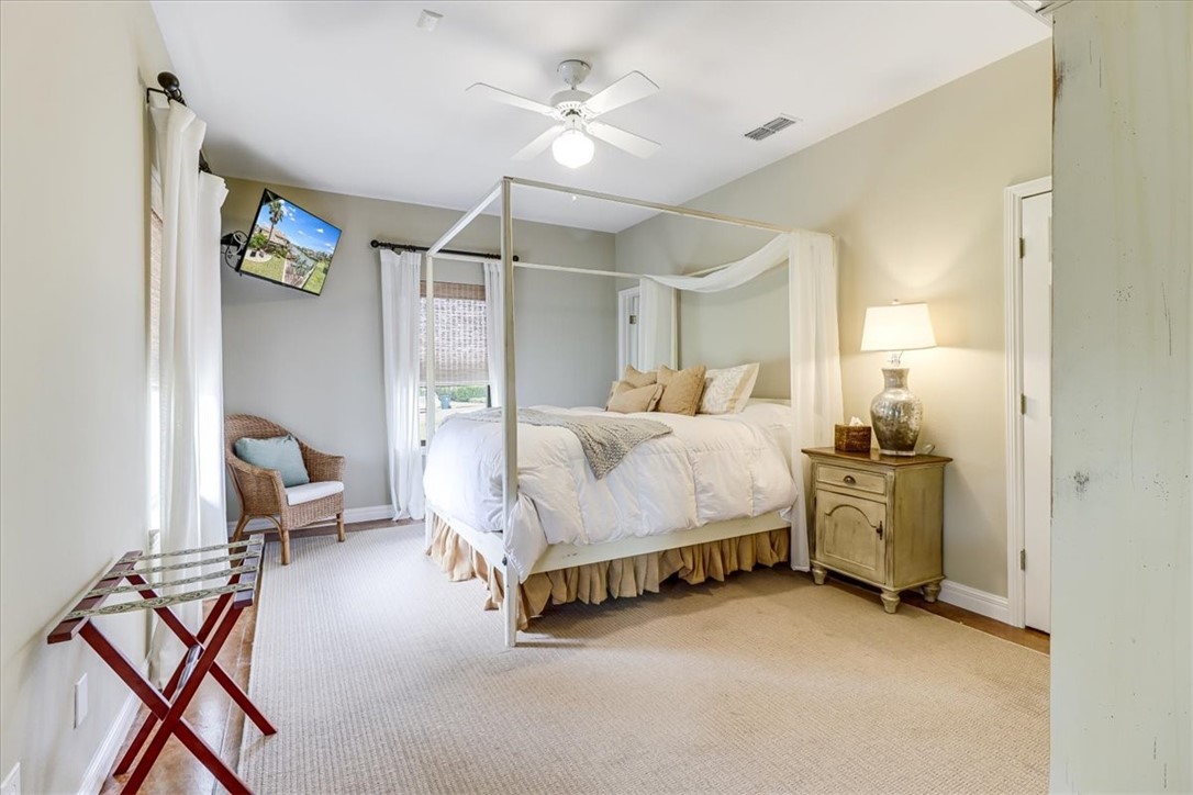 488 Margo Lane Port Aransas, TX 78373 - Photo 26 of 40 a bedroom with a bed and furniture