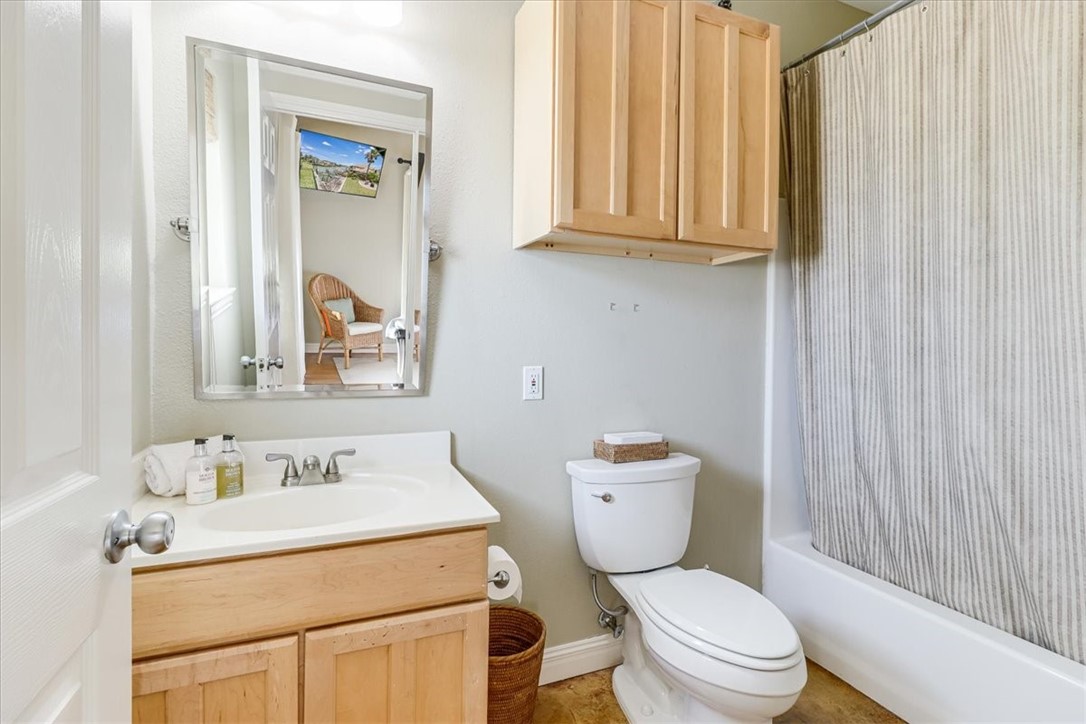 488 Margo Lane Port Aransas, TX 78373 - Photo 28 of 40 a bathroom with a sink toilet vanity and shower