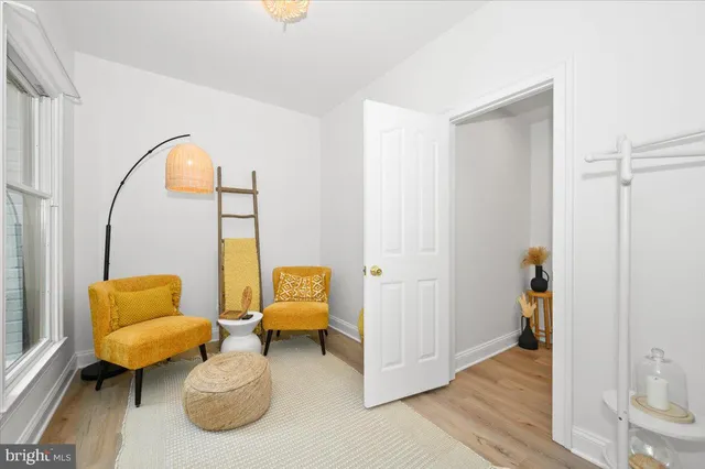 a close up of a stove top oven sitting inside of a white kitchen