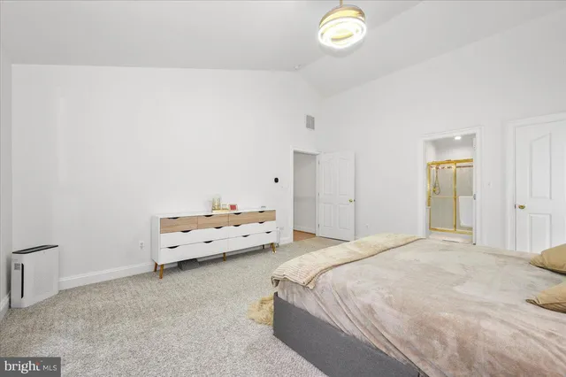 a bathroom with a tub and a shower