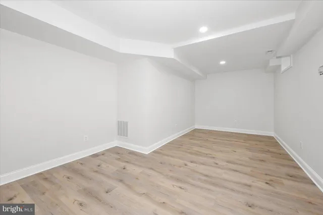 a view of a backyard with table and chairs potted plants and a palm tree