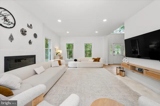 a living room with lots of furniture and a flat screen tv